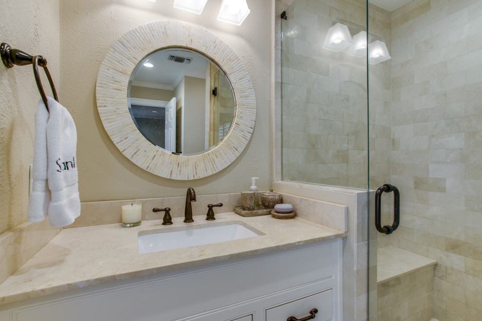 Small transitional 3/4 bathroom in Dallas with recessed-panel cabinets, white cabinets, an alcove shower, a two-piece toilet, beige tile, porcelain tile, beige walls, ceramic floors, an undermount sink, quartzite benchtops, beige floor and a hinged shower door.