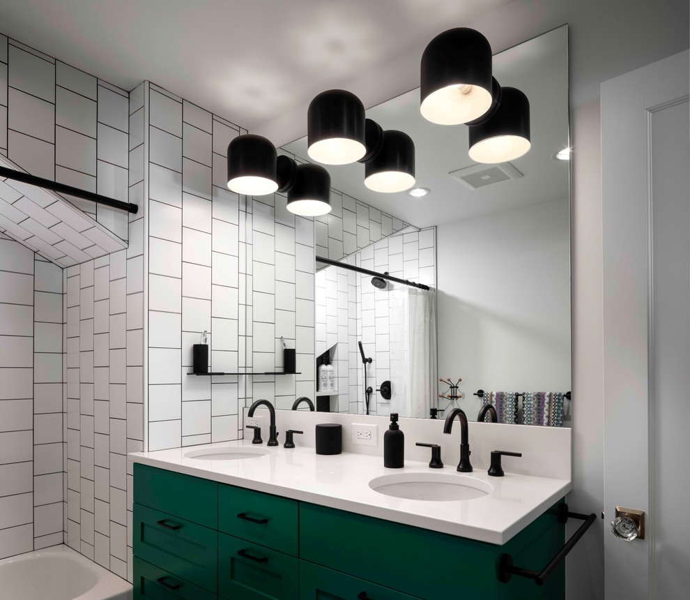 Inspiration for a large transitional kids bathroom in Portland with recessed-panel cabinets, green cabinets, an alcove tub, a shower/bathtub combo, a one-piece toilet, white tile, ceramic tile, white walls, mosaic tile floors, an undermount sink, quartzite benchtops, black floor, a shower curtain and white benchtops.