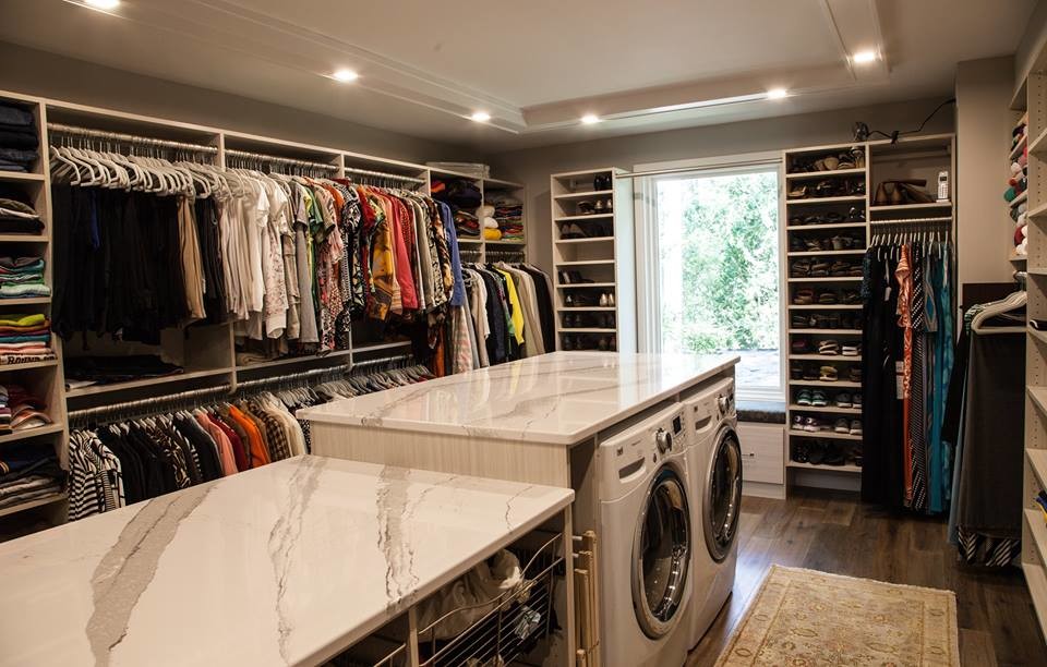 Inspiration for a large contemporary gender-neutral walk-in wardrobe in Other with open cabinets, white cabinets, dark hardwood floors and brown floor.