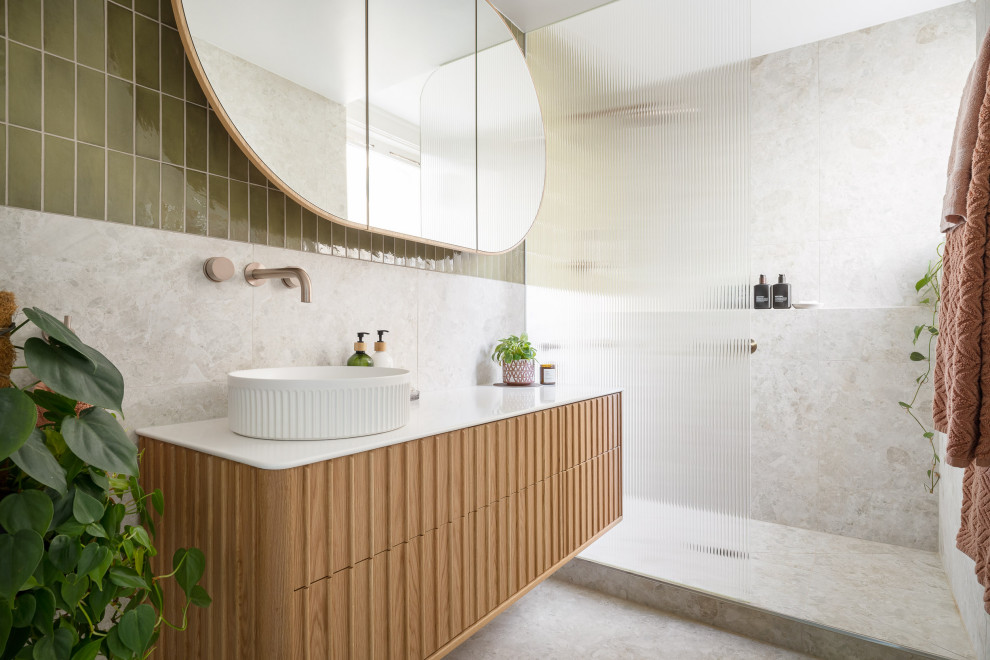 Small contemporary master bathroom in Melbourne with beaded inset cabinets, medium wood cabinets, an open shower, a one-piece toilet, white tile, porcelain tile, white walls, porcelain floors, a vessel sink, solid surface benchtops, white floor, an open shower, white benchtops, a single vanity and a floating vanity.