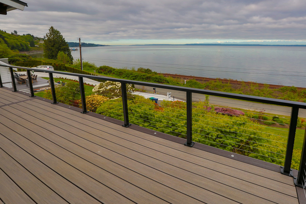 Example of a large beach style side yard deck design in Seattle