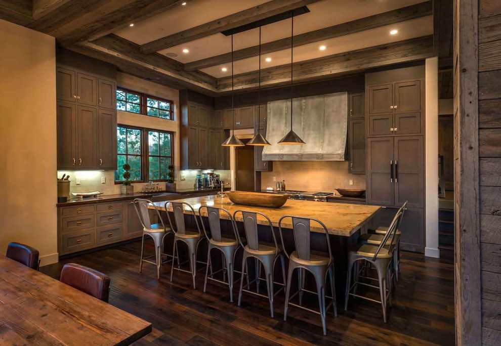 Country l-shaped eat-in kitchen in Sacramento with shaker cabinets, dark wood cabinets, beige splashback, panelled appliances, dark hardwood floors and with island.
