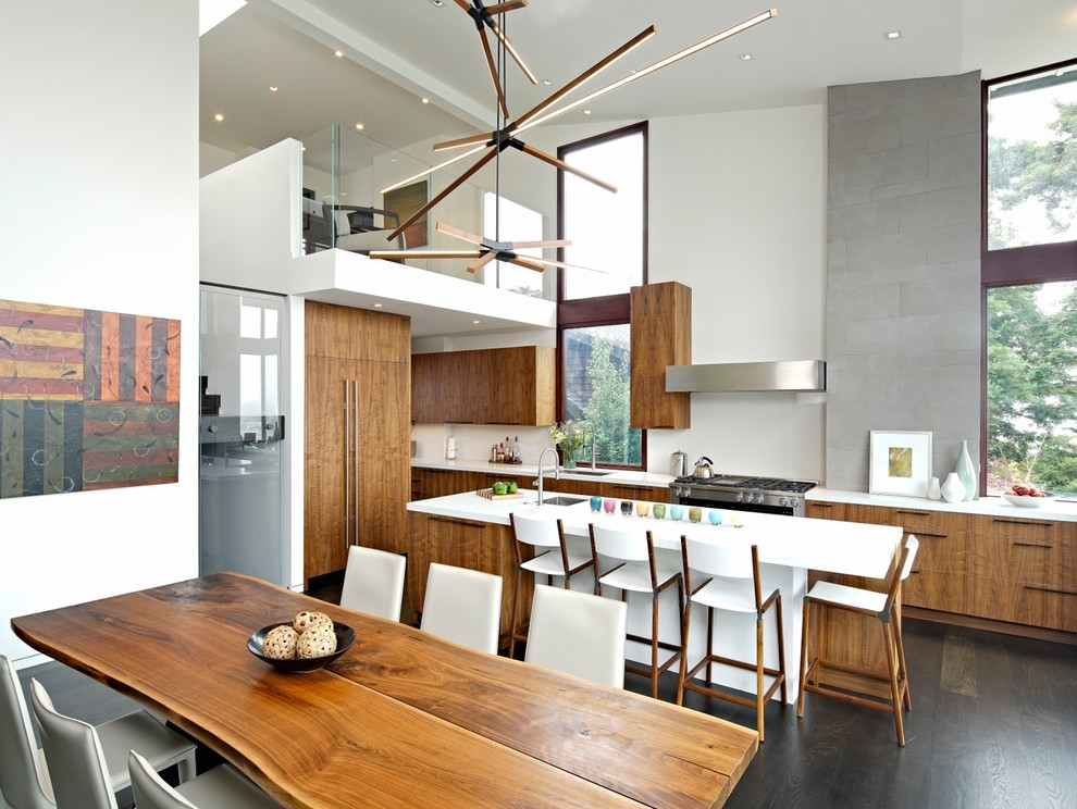 Design ideas for a large contemporary single-wall eat-in kitchen in San Francisco with an undermount sink, flat-panel cabinets, medium wood cabinets, white splashback, stainless steel appliances, dark hardwood floors, with island, white benchtop, quartz benchtops and grey floor.