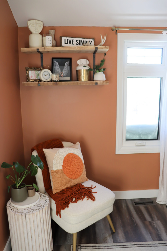 Small country home office in Other with orange walls, laminate floors, no fireplace, a freestanding desk, grey floor and wallpaper.