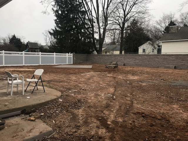 Fence installation after patio and retaining wall