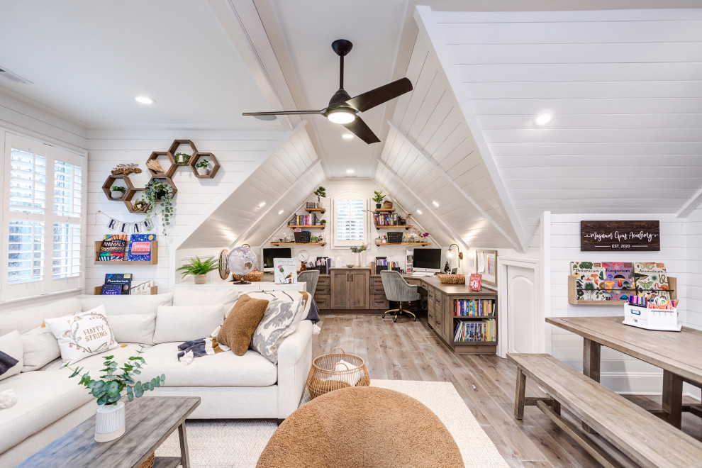 This is an example of a large classic gender neutral kids' study space in Raleigh with white walls, medium hardwood flooring, grey floors and tongue and groove walls.