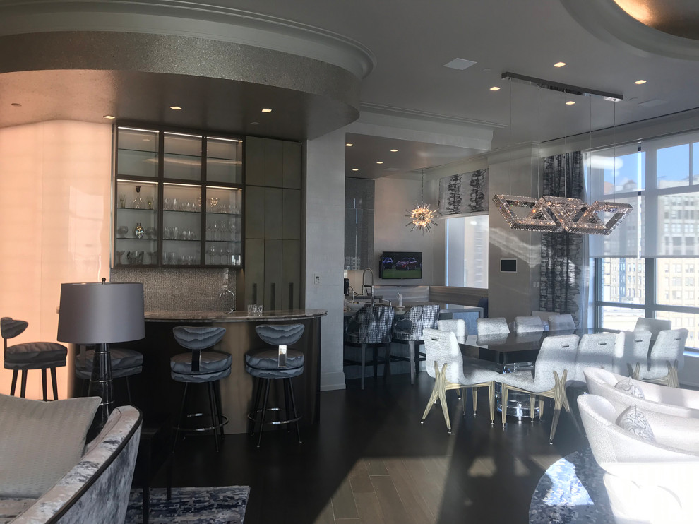 Kitchen/dining room combo - large transitional dark wood floor, brown floor, tray ceiling and wallpaper kitchen/dining room combo idea in New York with beige walls