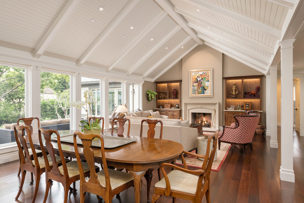 Traditional open plan dining in San Francisco with beige walls and bamboo floors.