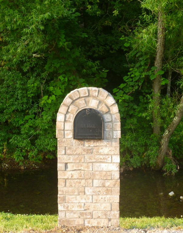 Inspiration for a small transitional hillside brick landscaping in Nashville for spring.