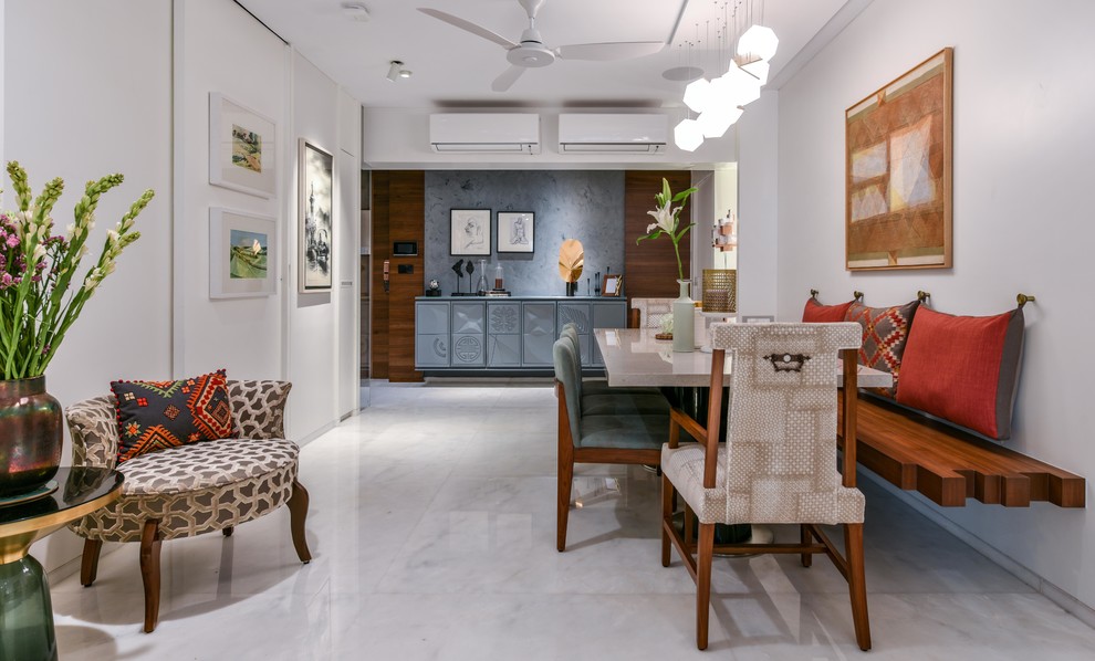 Design ideas for an asian open plan dining in Mumbai with white walls, white floor and marble floors.
