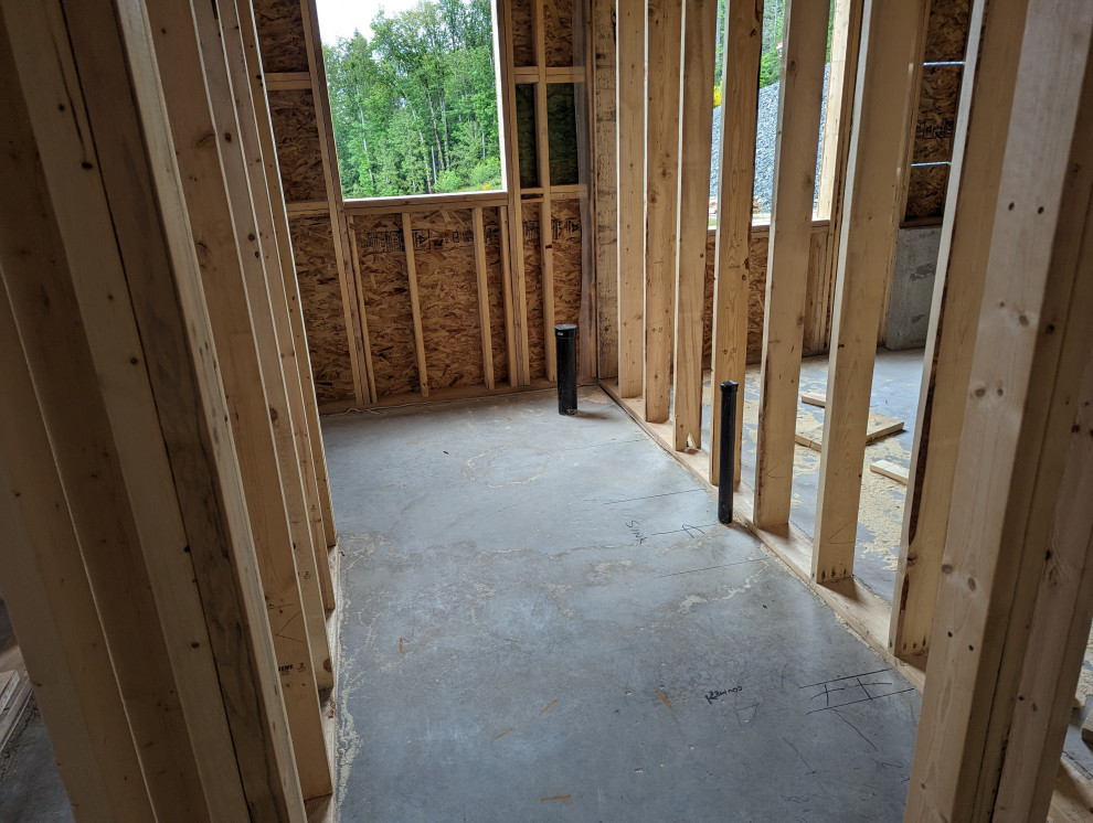 Framed interior walls of prefab home under construction.