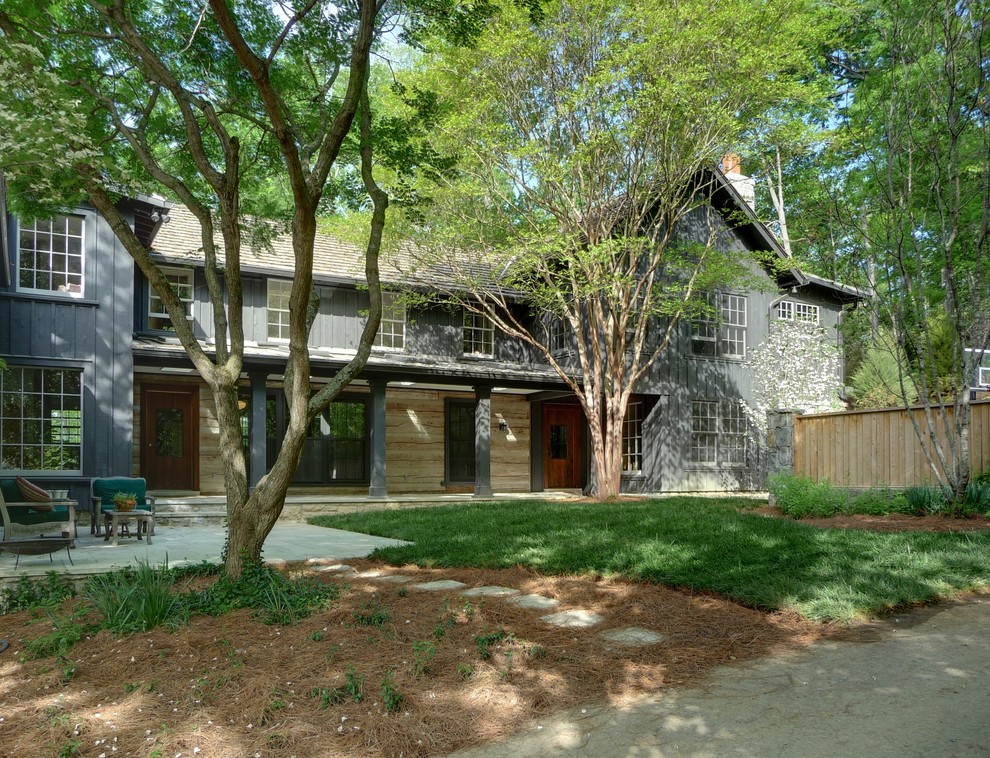 This is an example of a contemporary grey exterior in Nashville with wood siding and a gable roof.