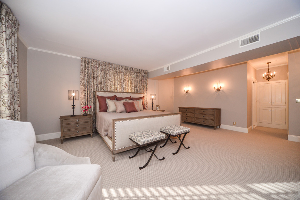 Design ideas for a large transitional master bedroom in New York.
