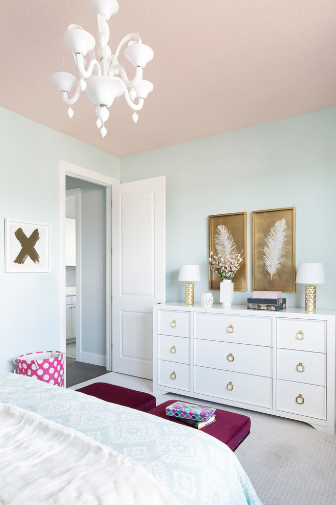 This is an example of a transitional kids' bedroom for kids 4-10 years old and girls in Miami with blue walls, carpet and beige floor.