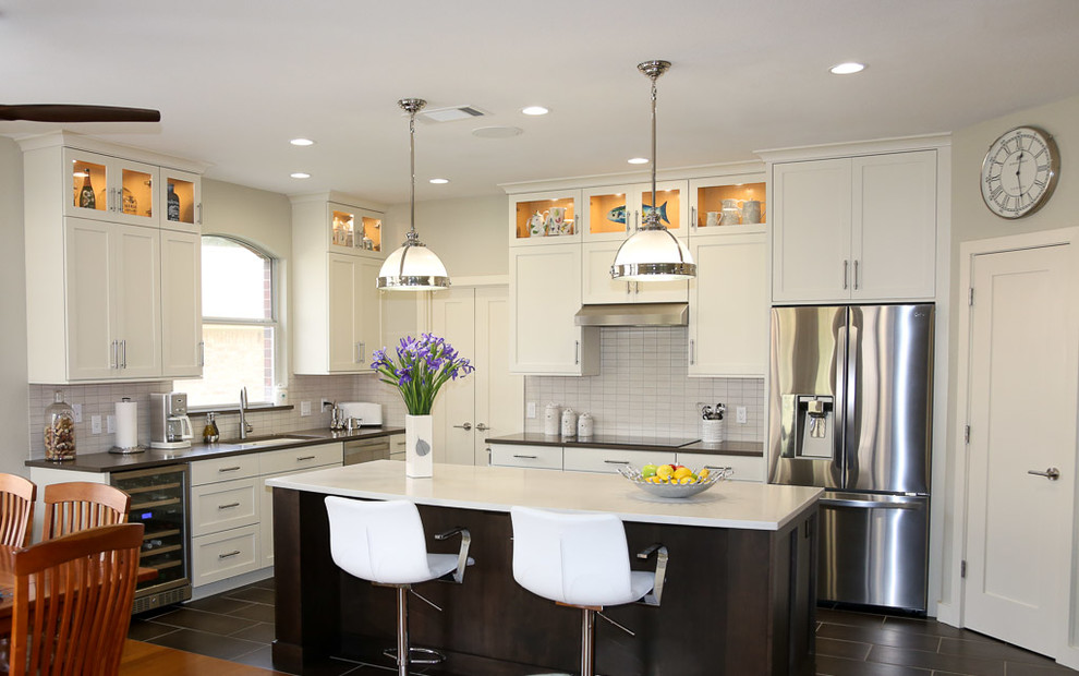 Photo of a transitional eat-in kitchen in Austin with shaker cabinets, white cabinets and with island.