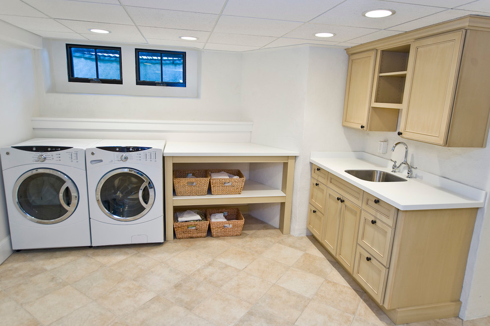 Inspiration for a traditional l-shaped laundry room in Philadelphia with white walls and a side-by-side washer and dryer.