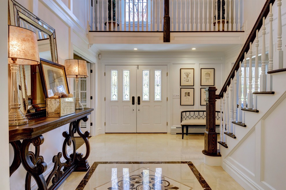 Inspiration for a large traditional entryway in New York with white walls, ceramic floors, a double front door and a white front door.