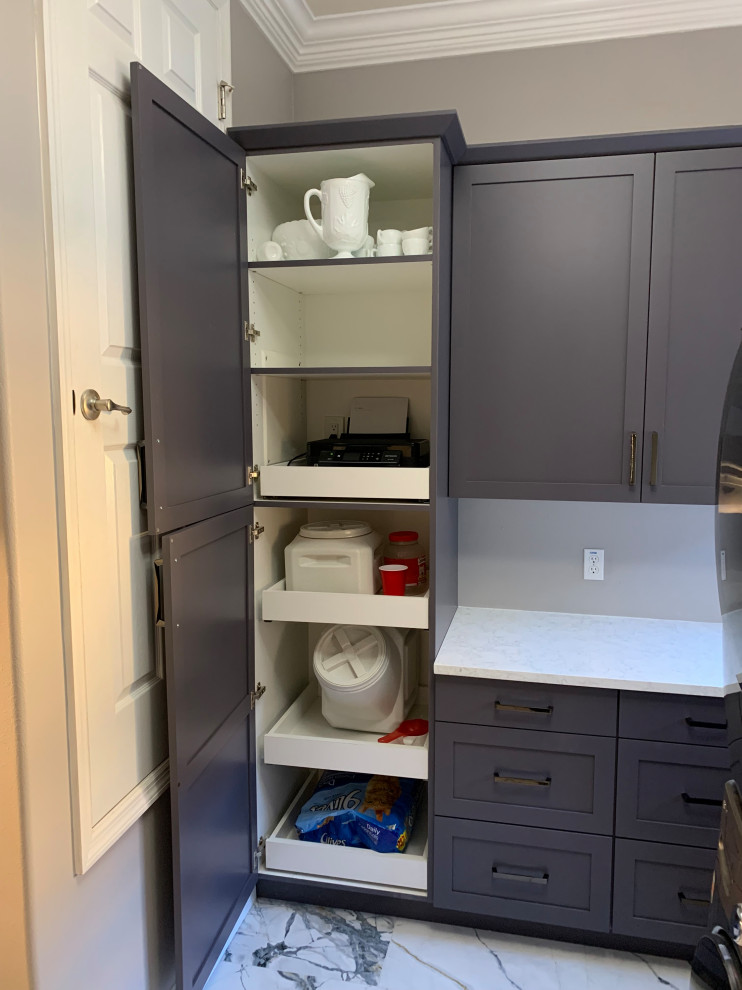 Mid-sized contemporary single-wall dedicated laundry room in Orlando with an undermount sink, shaker cabinets, grey cabinets, quartz benchtops, white splashback, engineered quartz splashback, grey walls, porcelain floors, a stacked washer and dryer, multi-coloured floor and white benchtop.