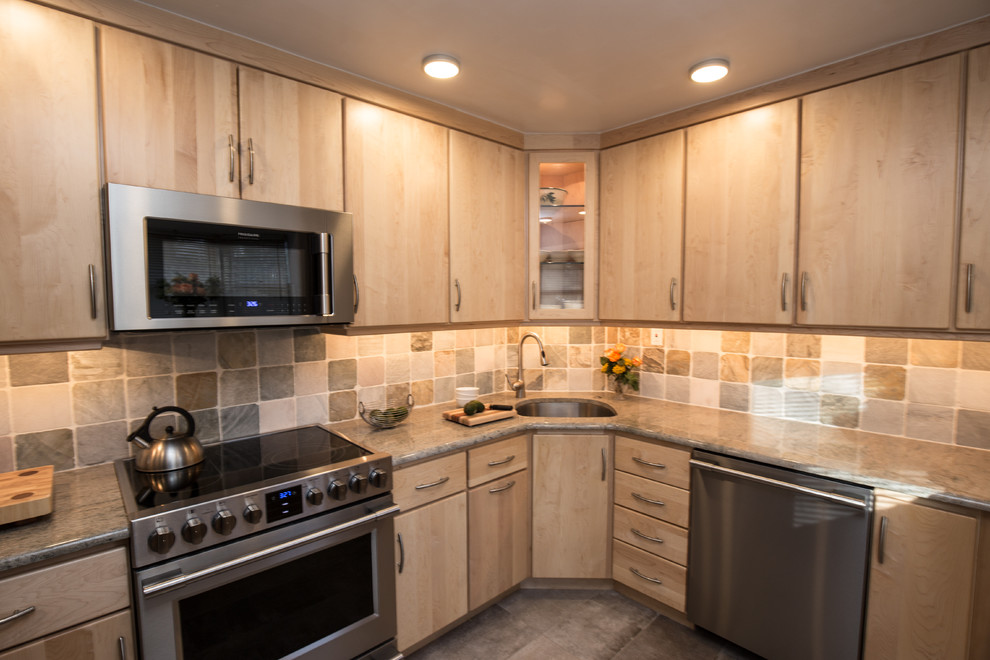 Photo of a small transitional l-shaped kitchen in Philadelphia with an undermount sink, flat-panel cabinets, light wood cabinets, granite benchtops, mosaic tile splashback and slate floors.