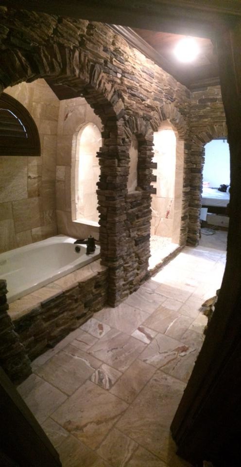 Drop-in bathtub - small rustic master travertine floor drop-in bathtub idea with a vessel sink and granite countertops