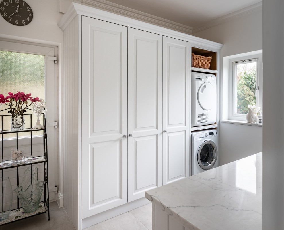 Design ideas for a large traditional l-shaped kitchen in Essex with an undermount sink, raised-panel cabinets, grey cabinets, quartzite benchtops, white splashback, stainless steel appliances, porcelain floors, with island, beige floor and white benchtop.