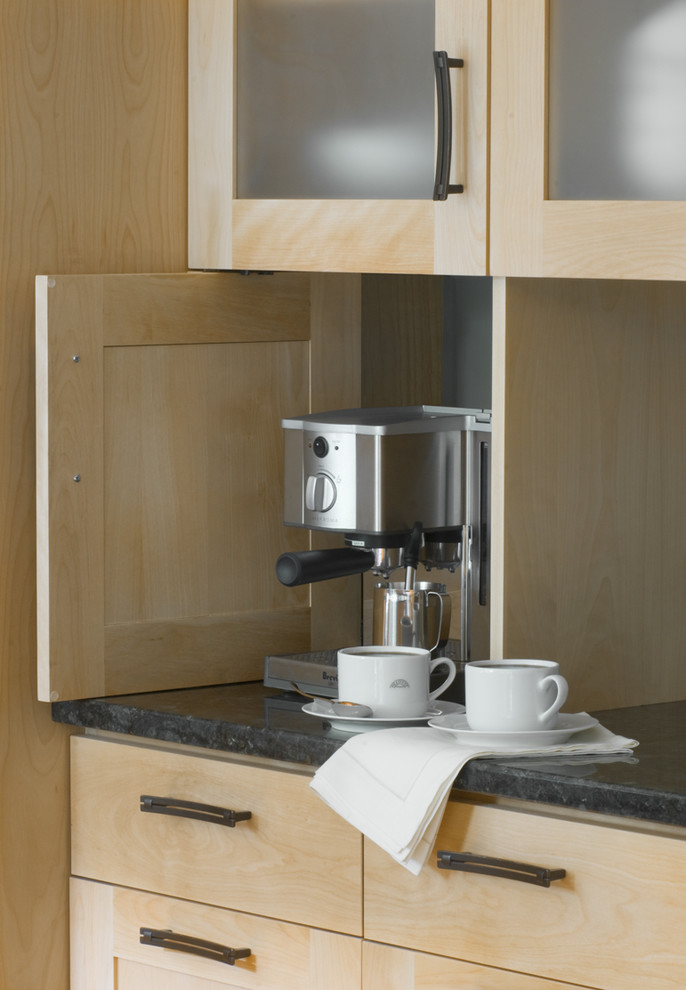 Inspiration for a small transitional u-shaped eat-in kitchen remodel in Burlington with shaker cabinets, light wood cabinets, granite countertops, stainless steel appliances and an island