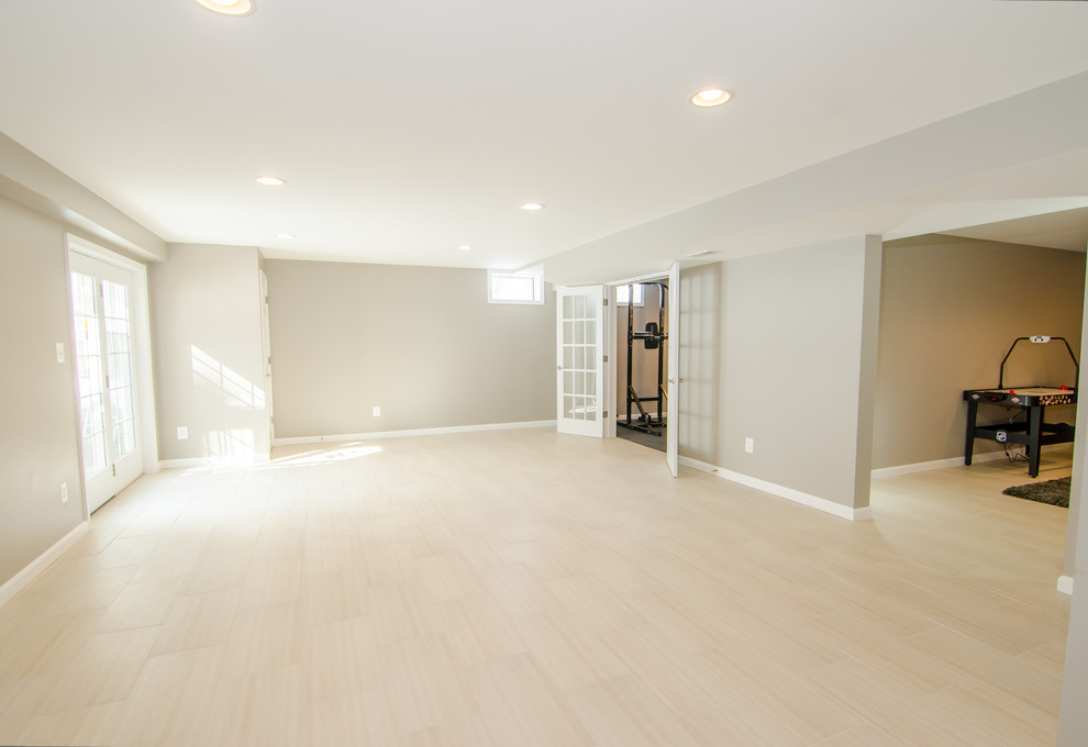 Design ideas for an expansive contemporary basement in DC Metro.