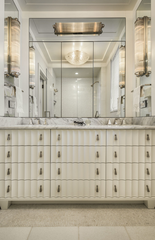 Design ideas for a traditional bathroom in New York with white cabinets and white walls.