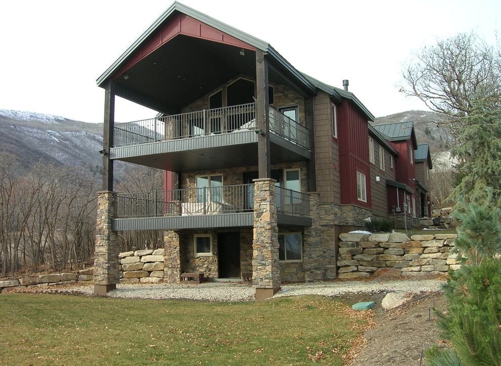 Large country three-storey multi-coloured exterior in Salt Lake City with mixed siding.