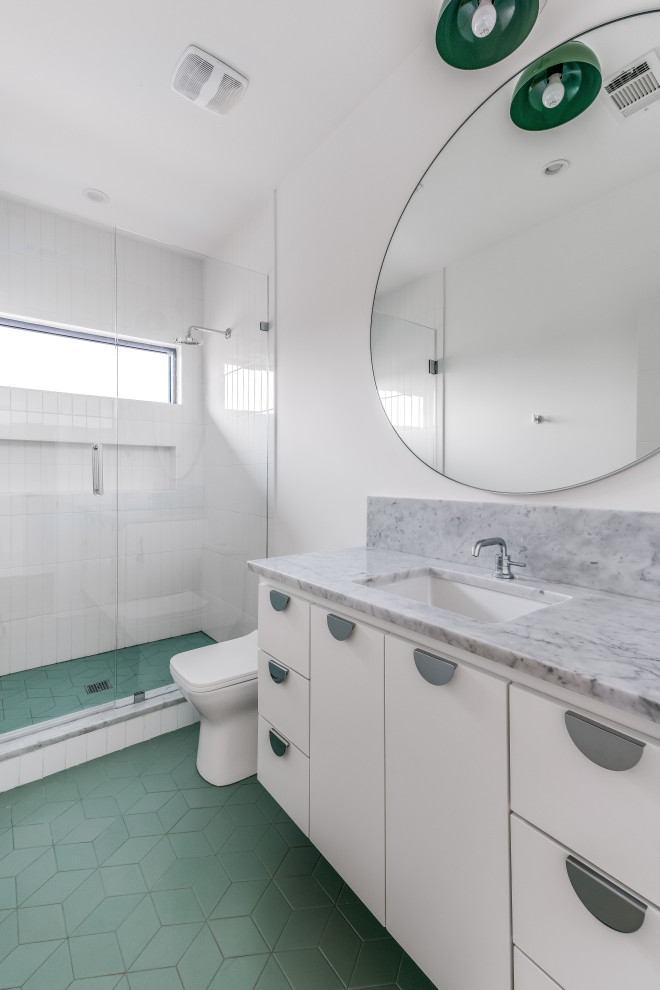 Bathroom - large 1960s white tile and ceramic tile porcelain tile, green floor and single-sink bathroom idea in Dallas with flat-panel cabinets, white cabinets, white walls, an undermount sink, marble countertops, a hinged shower door, white countertops and a floating vanity