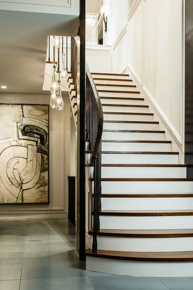 Photo of a transitional wood straight staircase in Seattle with painted wood risers.