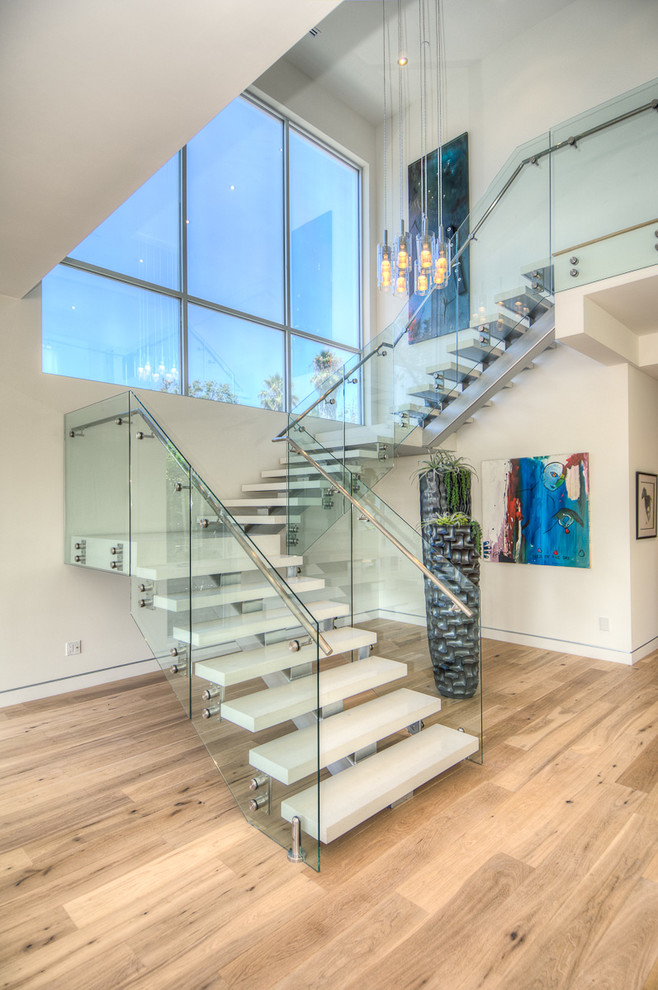 Inspiration for a large contemporary u-shaped staircase in Los Angeles with open risers.