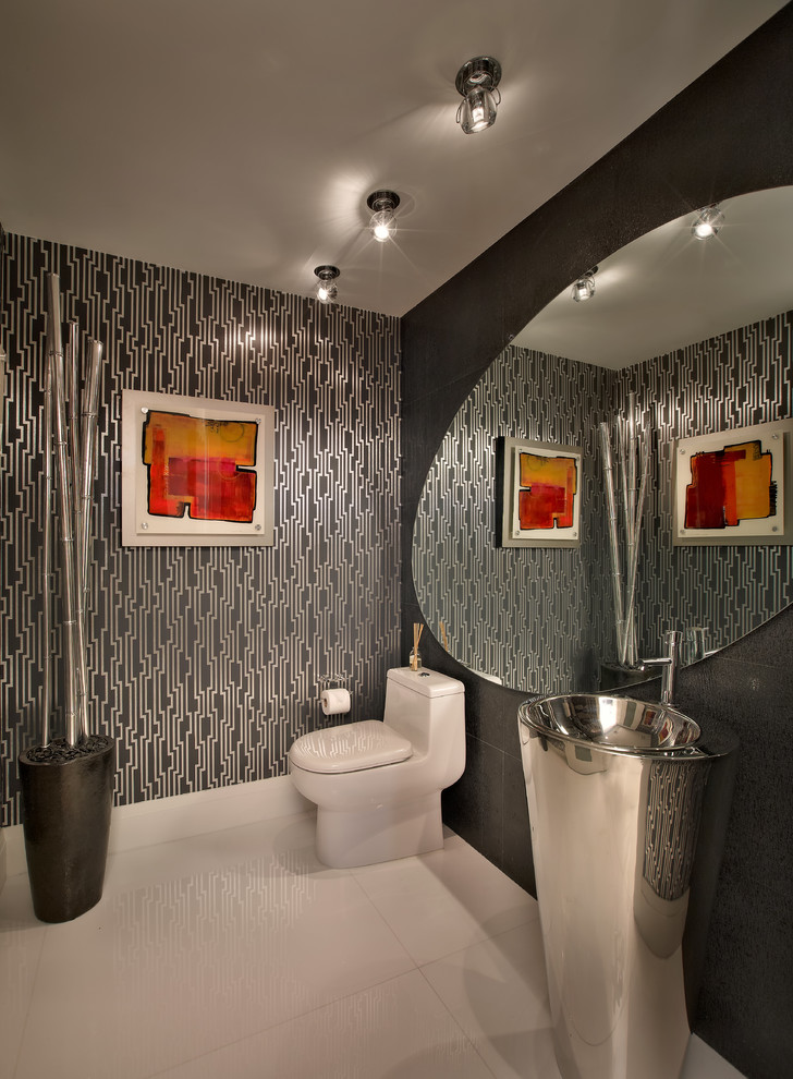 Inspiration for a contemporary powder room in Miami with a one-piece toilet and a pedestal sink.