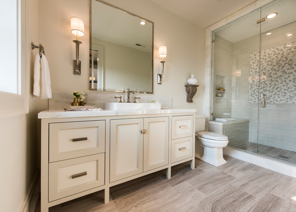 Inspiration for a traditional 3/4 bathroom in Salt Lake City with recessed-panel cabinets, beige cabinets, an alcove shower, a two-piece toilet, beige tile, beige walls, a drop-in sink, brown floor, a hinged shower door and white benchtops.