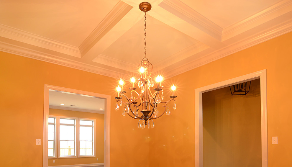 Enclosed dining room - mid-sized transitional dark wood floor enclosed dining room idea with yellow walls and no fireplace