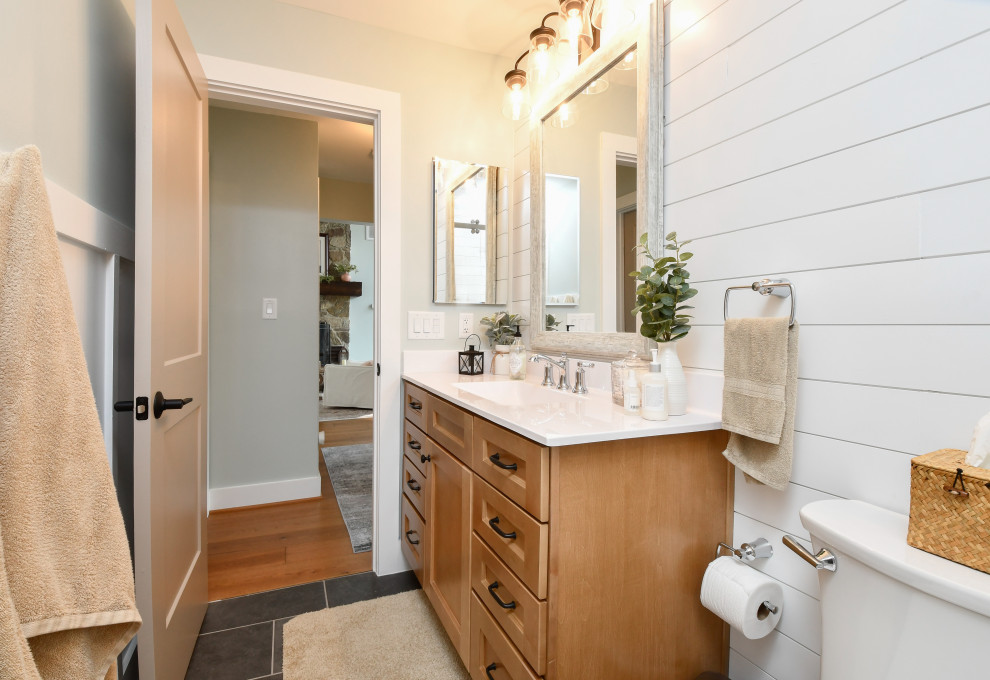 Inspiration for a mid-sized transitional master bathroom in DC Metro with recessed-panel cabinets, light wood cabinets, a corner shower, white tile, subway tile, marble benchtops, a sliding shower screen, white benchtops, a niche, a single vanity and a floating vanity.