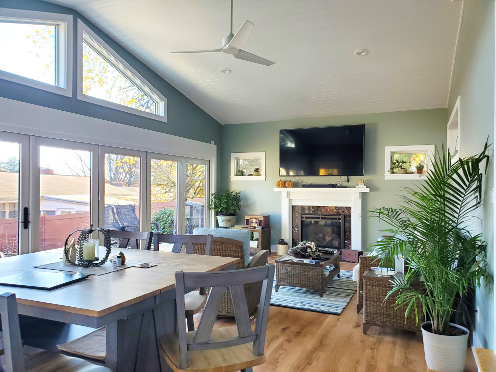Example of a mid-sized eclectic vinyl floor and brown floor sunroom design in Other
