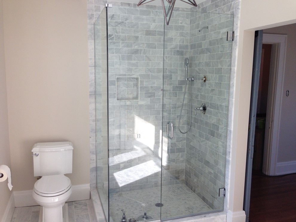 Transitional master white tile and stone tile marble floor corner shower photo in Cincinnati with a two-piece toilet and beige walls