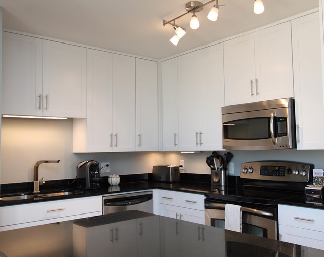 White Contemporary Kitchen With Brushed Nickel Hardware And Black