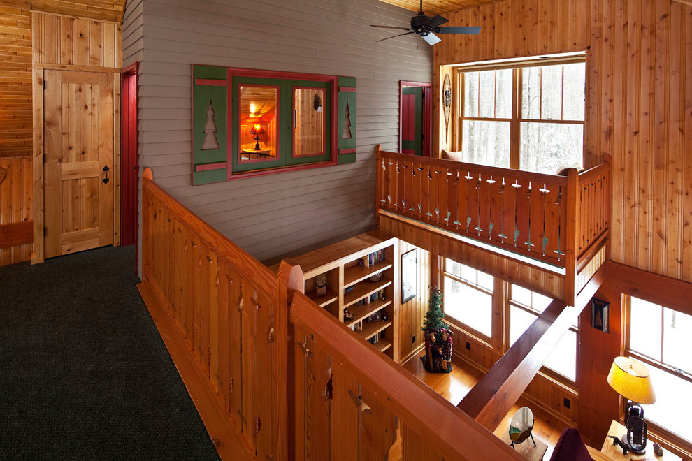 Example of a mountain style home design design in Minneapolis