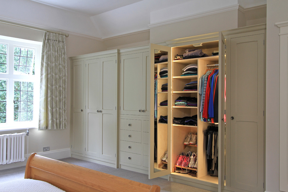 Design ideas for a large traditional storage and wardrobe in Hampshire with carpet.