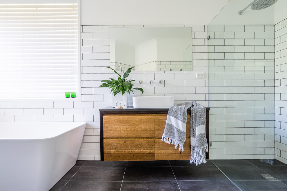 Photo of a contemporary bathroom in Sydney with furniture-like cabinets.