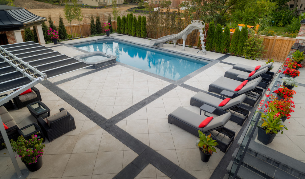 Pool house - backyard rectangular pool house idea in Toronto