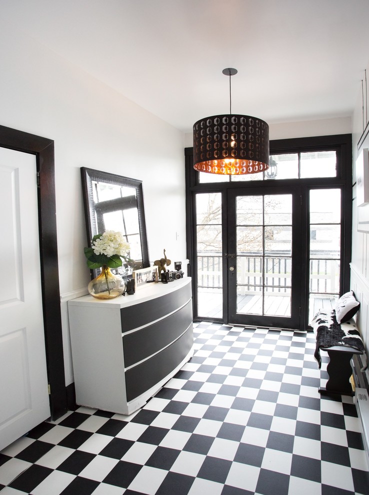 Inspiration for a mid-sized transitional vinyl floor and black floor entry hall remodel with white walls and a black front door