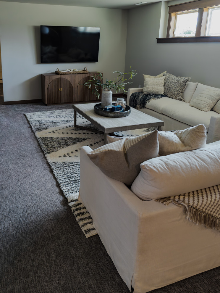 Inspiration for a transitional look-out carpeted and gray floor basement remodel with a bar