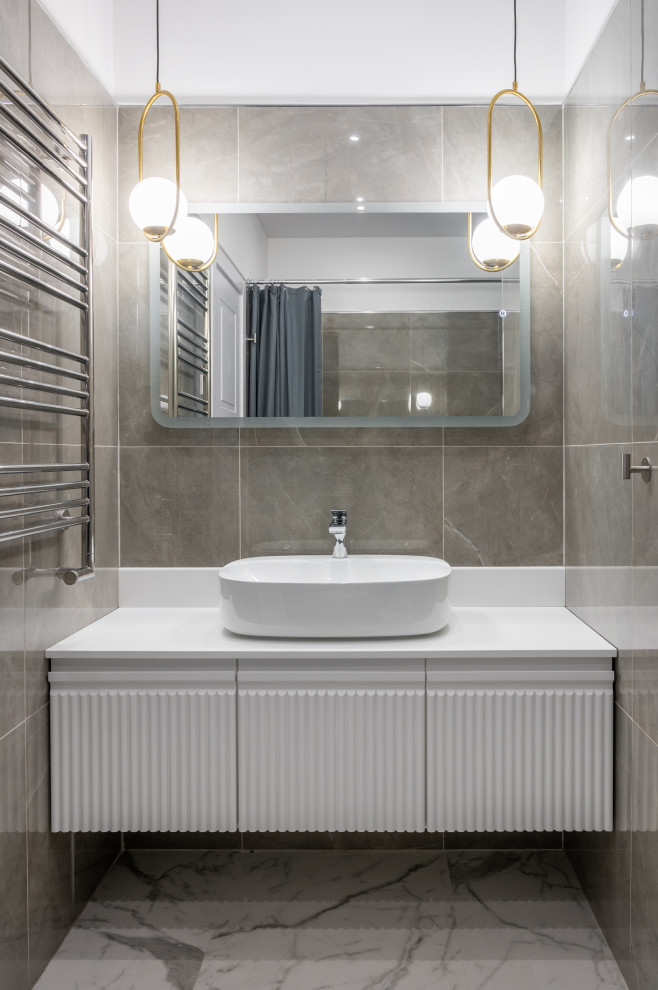Immagine di una stanza da bagno minimal di medie dimensioni con lavabo a bacinella