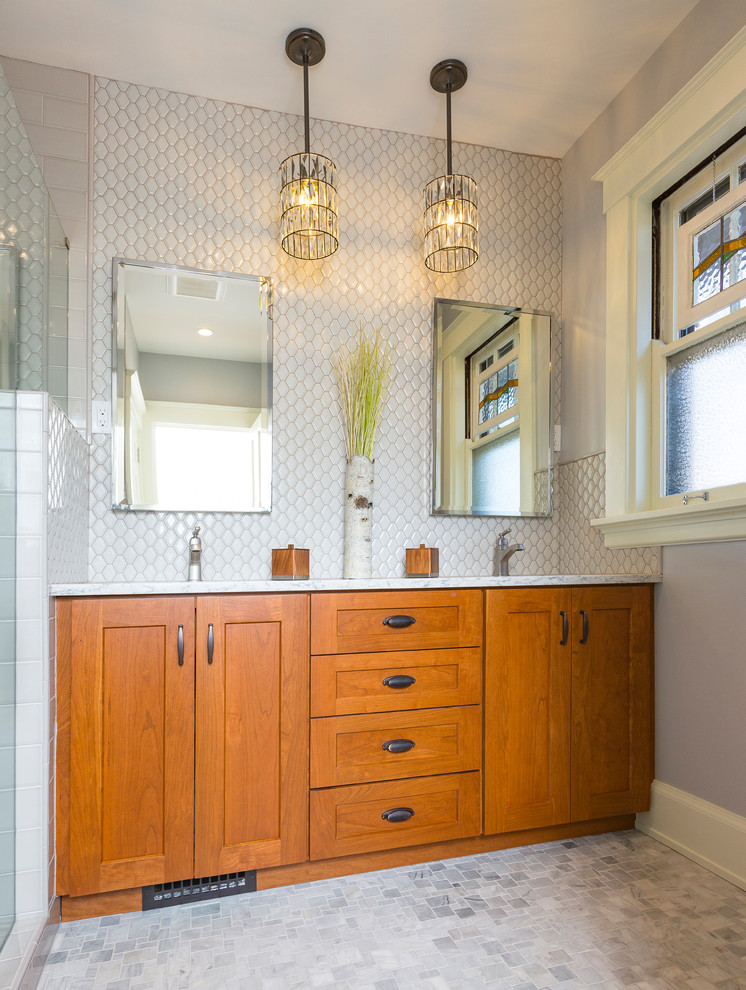 This is an example of a small arts and crafts master bathroom in Cincinnati with flat-panel cabinets, medium wood cabinets, an alcove shower, a one-piece toilet, white tile, porcelain tile, white walls, porcelain floors, an undermount sink, quartzite benchtops, grey floor and a hinged shower door.
