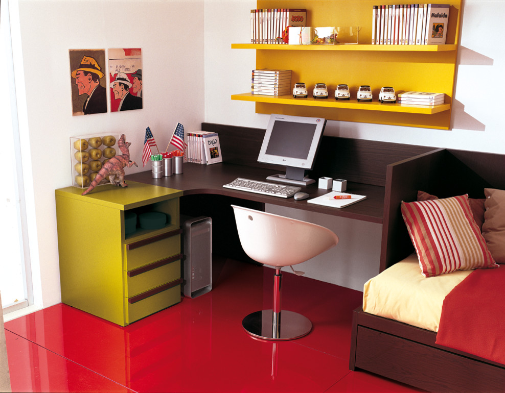 This is an example of a large contemporary kids' study room for kids 4-10 years old and boys in Dusseldorf with white walls, painted wood floors and red floor.