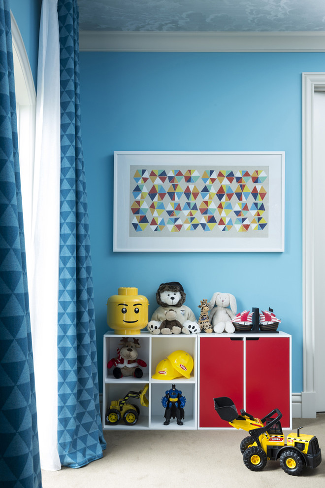 This is an example of a large contemporary kids' bedroom for kids 4-10 years old and boys in Melbourne with blue walls, carpet and brown floor.