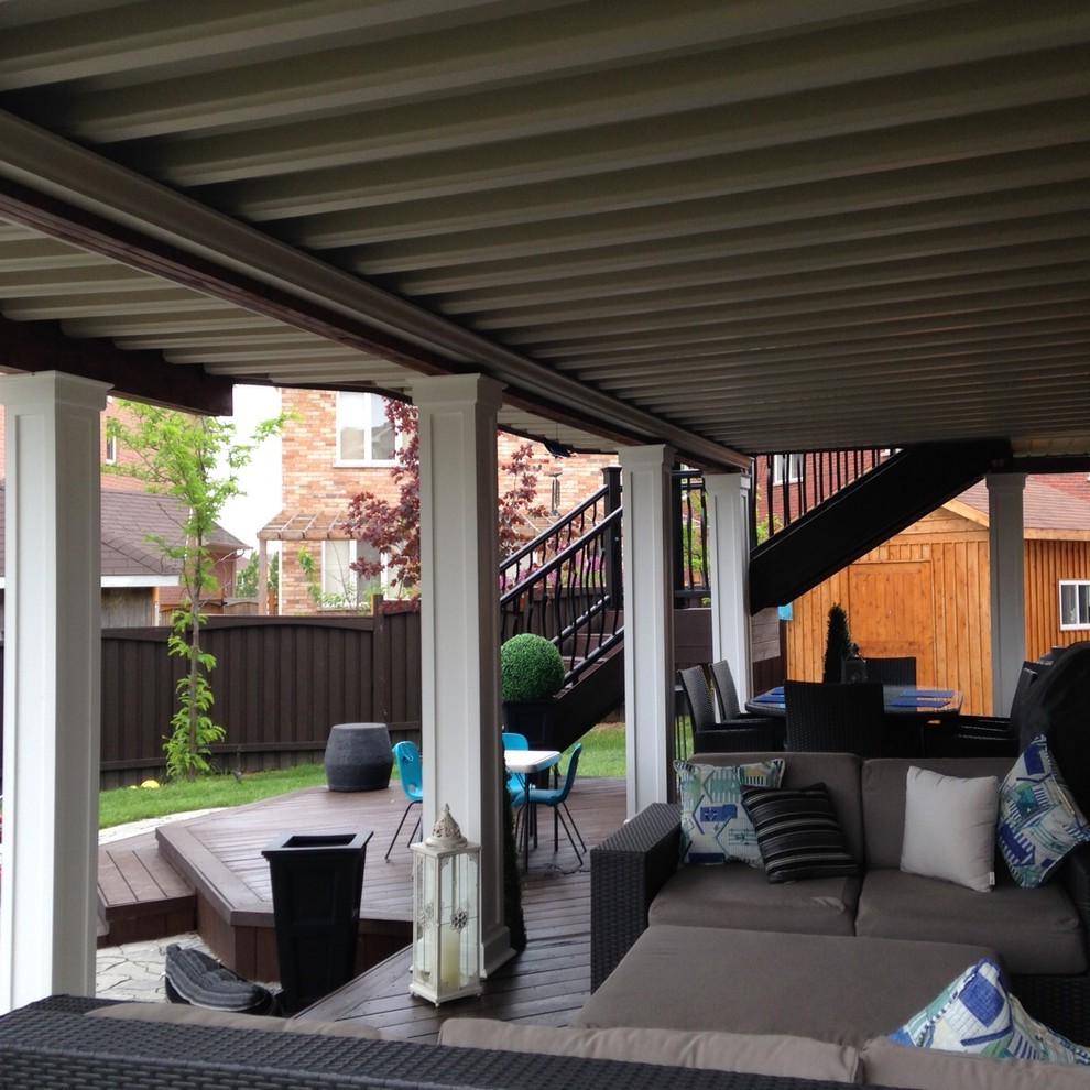 Mid-sized minimalist backyard deck photo in Toronto